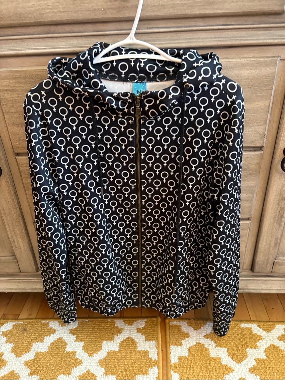 Women's Black Zip Hoodie with White Female Empowerment Symbol Print